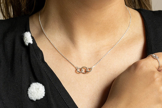 What is that necklace everyone is wearing?