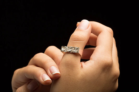 Elegant upcycled or handmade pieces jewelry trends displayed on a model's hand