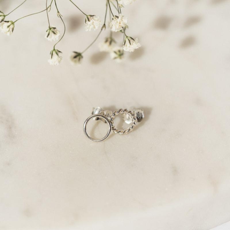 Silver Carly Studs by Luisana Jewelry featuring a unique twisted design and smooth circle detail