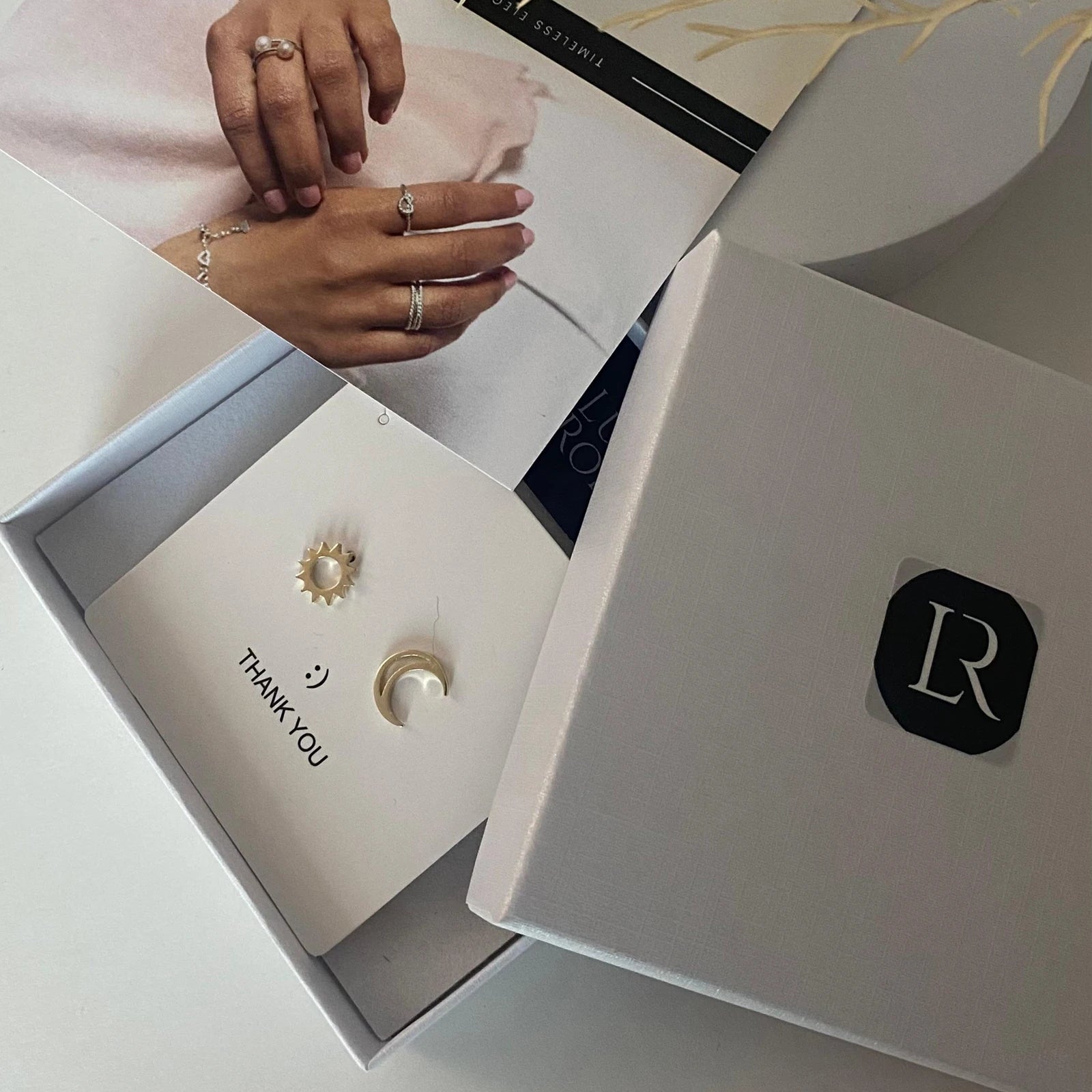 Elegant Luisana Jewelry Celestial Studs earrings packaged in a thank you box with a card