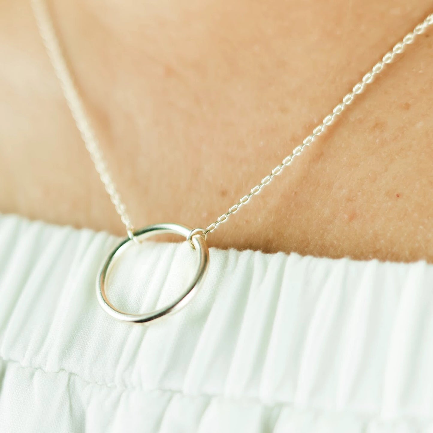 Luisana Jewelry Cloe Necklace featuring a sleek circle pendant on a delicate chain