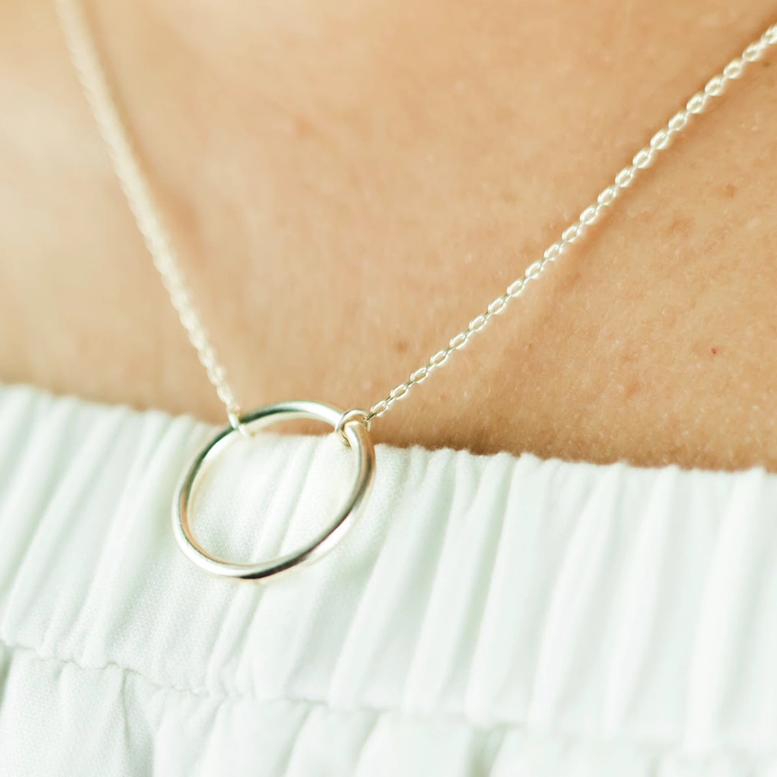 Luisana Jewelry Cloe Necklace featuring a sleek circle pendant on a delicate chain