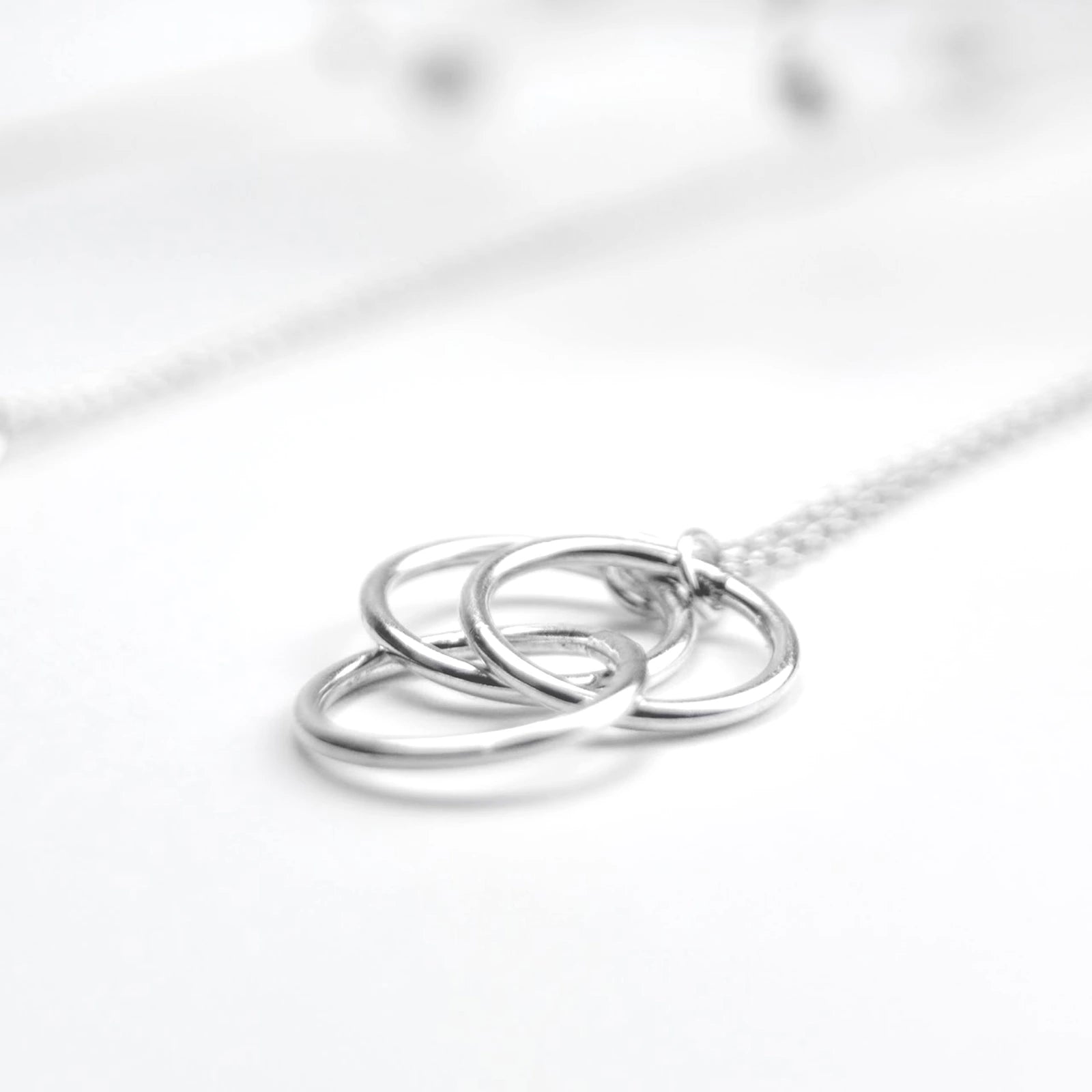 Luisana Jewelry Cloe Necklace featuring three interlocking silver rings on a delicate chain