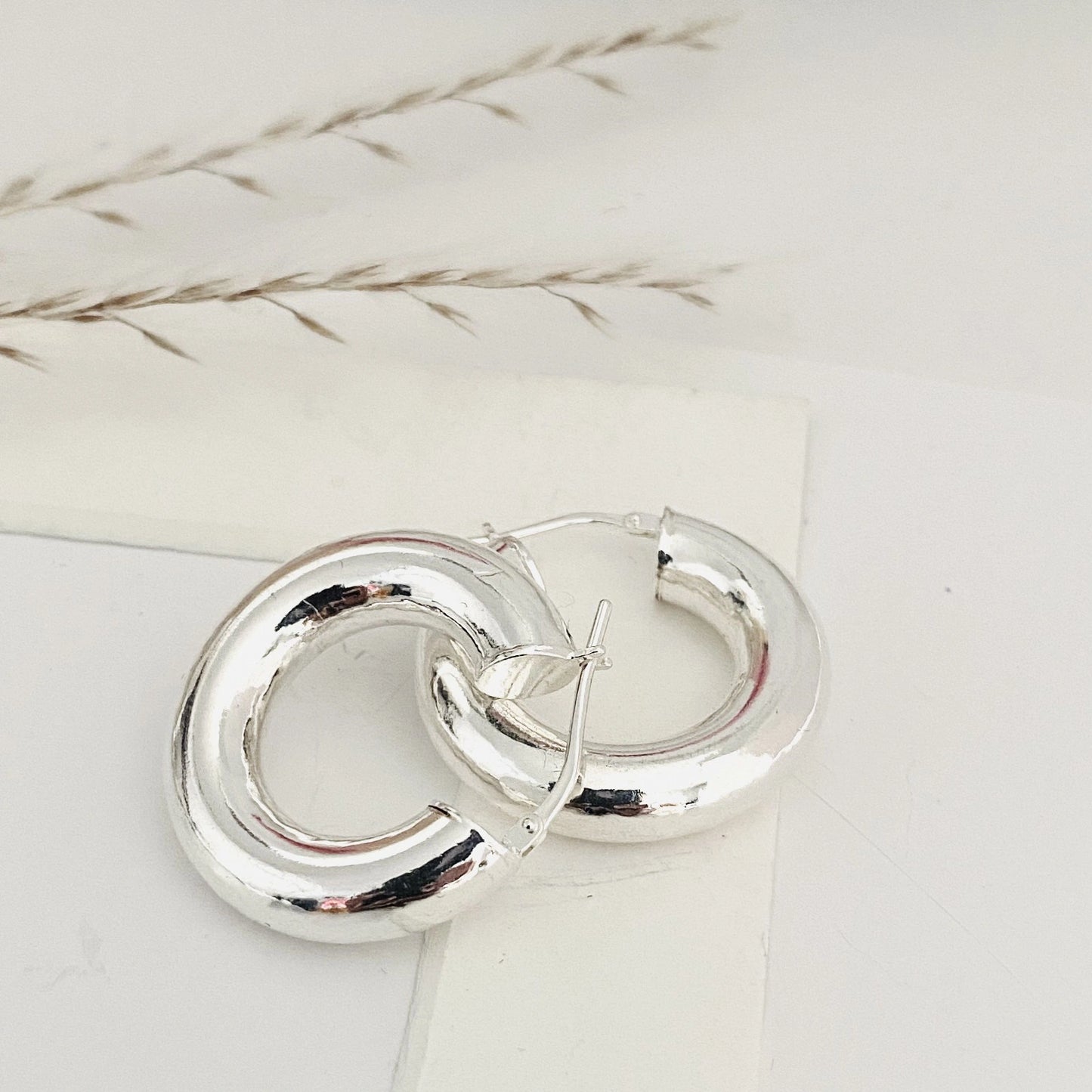 Sterling silver Ellen Hoops earrings with a polished finish for an elegant look