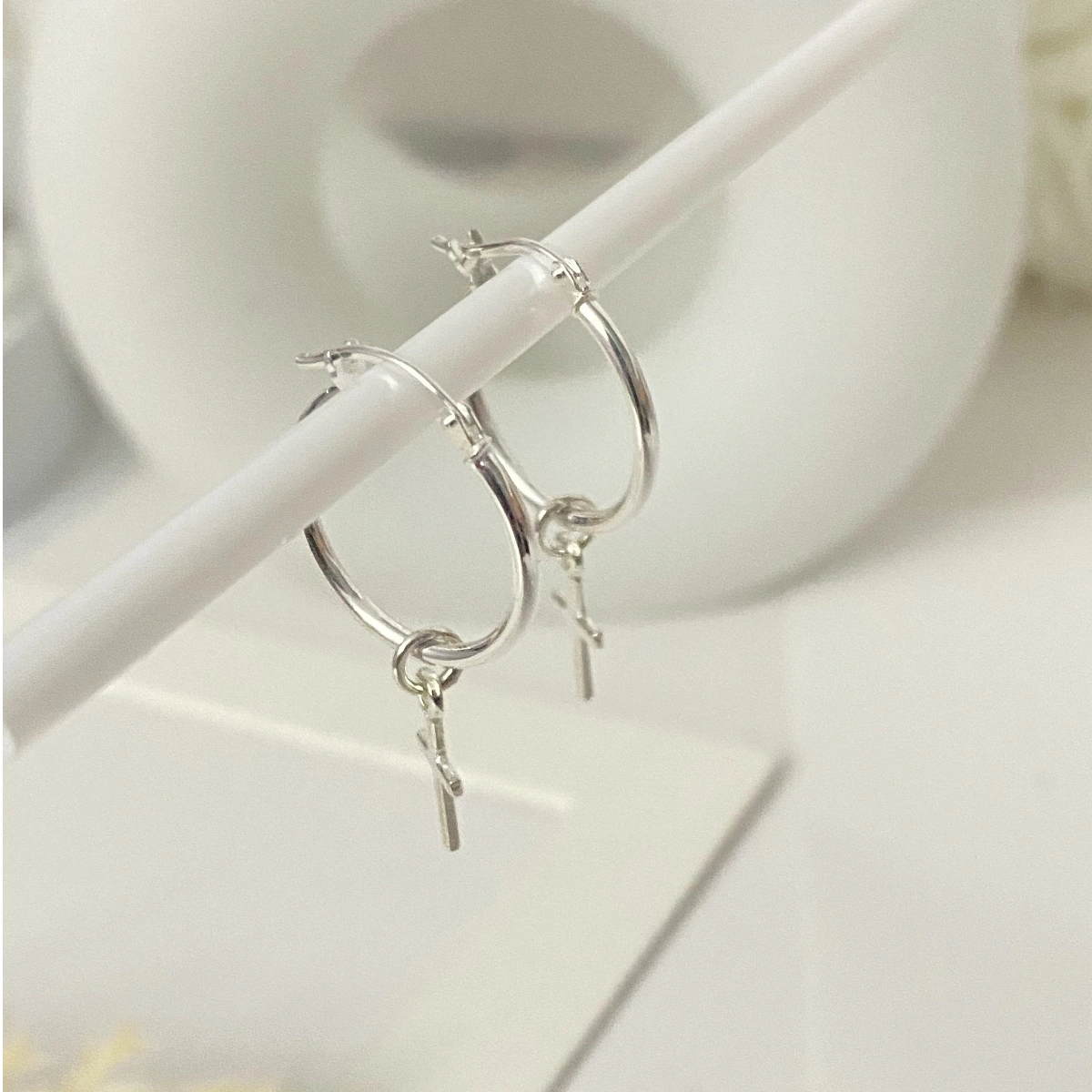 Stylish silver Faith Hoops earrings with cross charm for a timeless, elegant look
