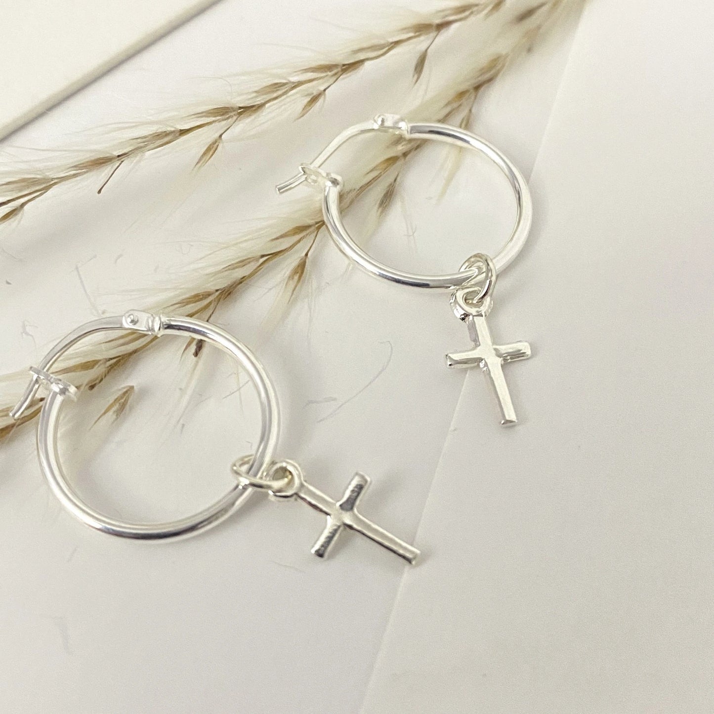 Silver Faith Hoops earrings featuring dangling cross charms for a chic look