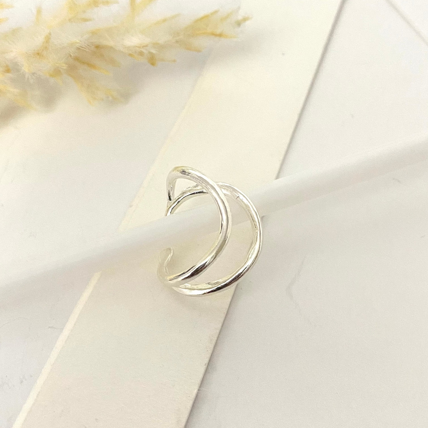 Luisana Jewelry Flow Ear Cuff in silver with a modern, minimalist design for stylish ear accessories