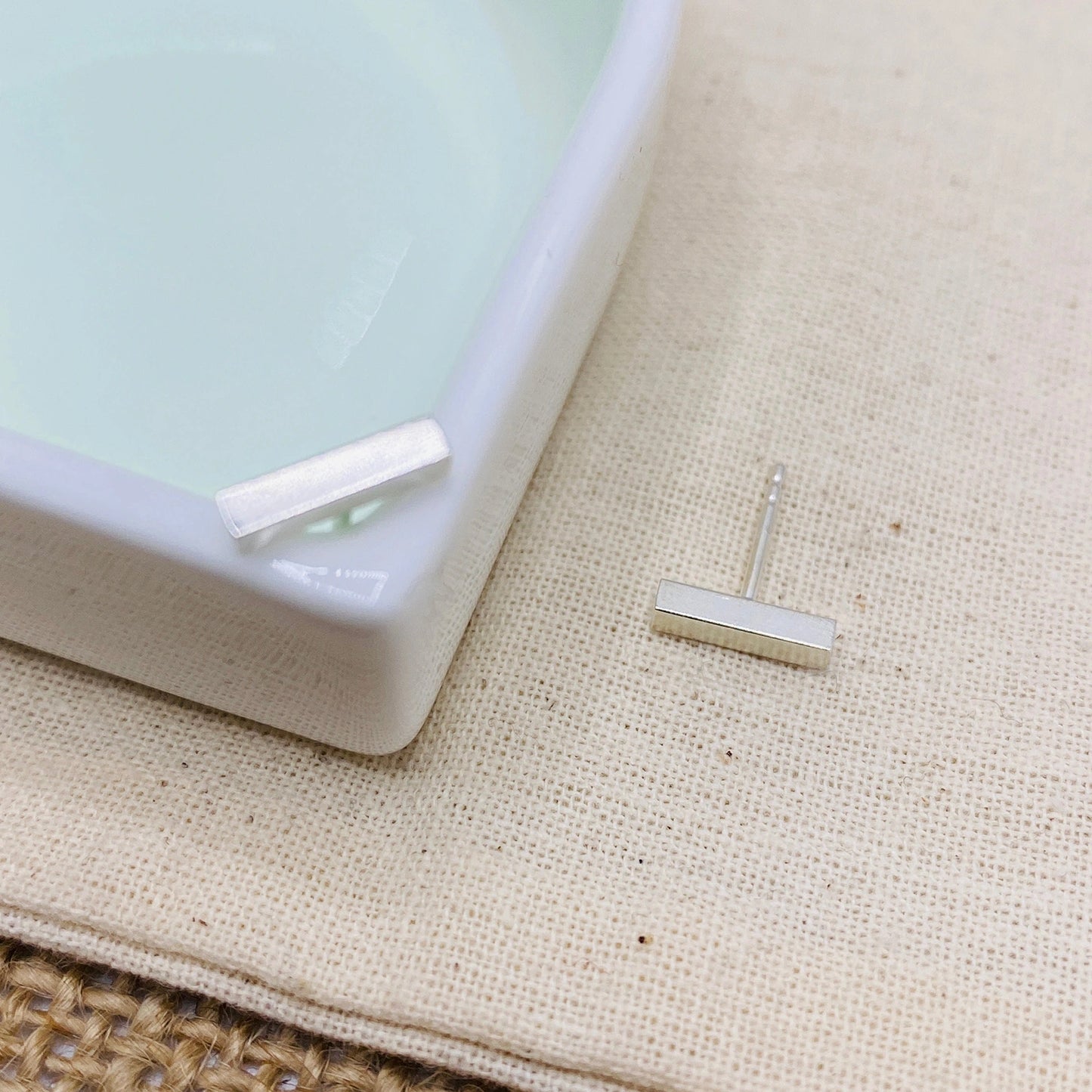 Luisana Jewelry Grace Studs Silver Earrings in Minimalist Design on a Styled Dish