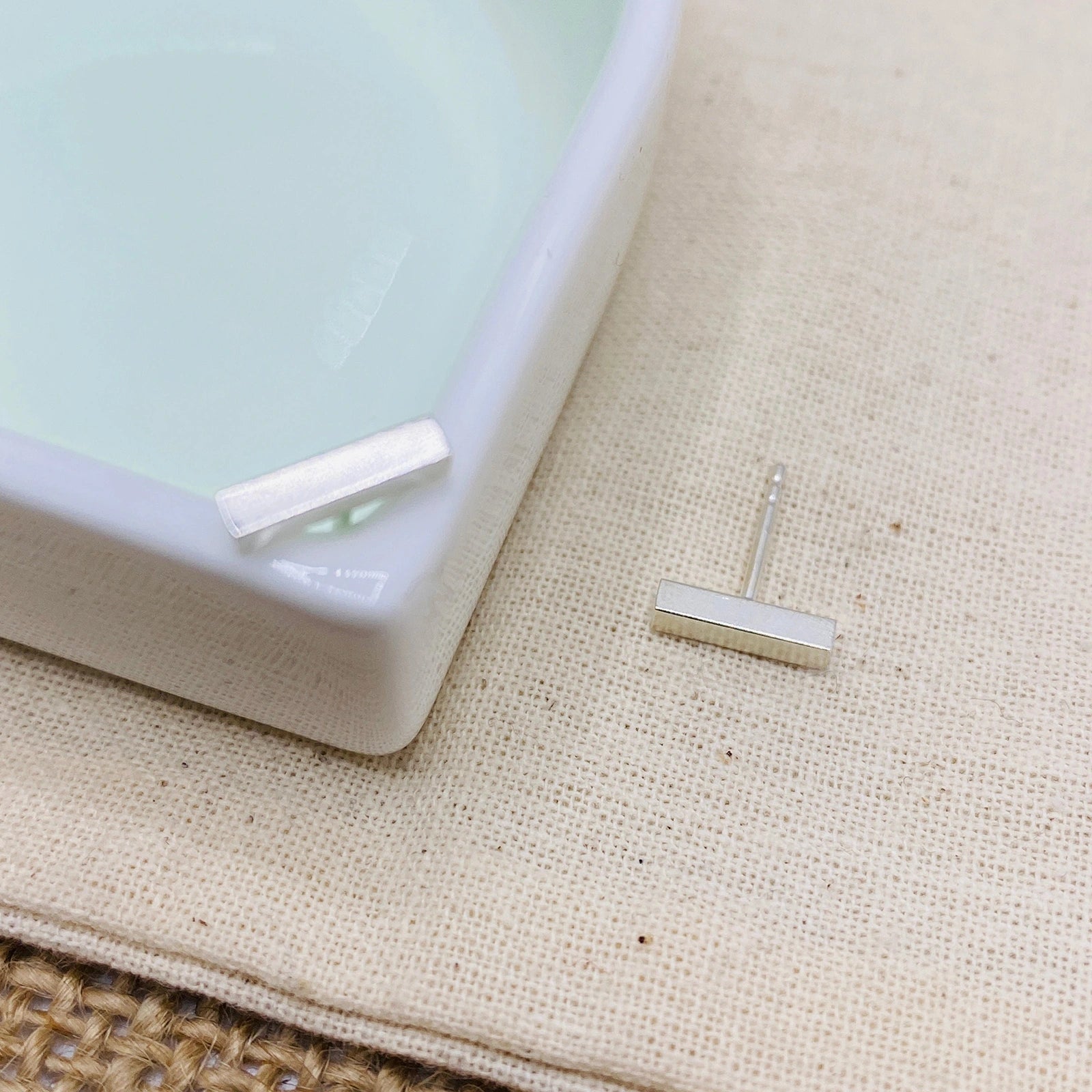 Luisana Jewelry Grace Studs Silver Earrings in Minimalist Design on a Styled Dish