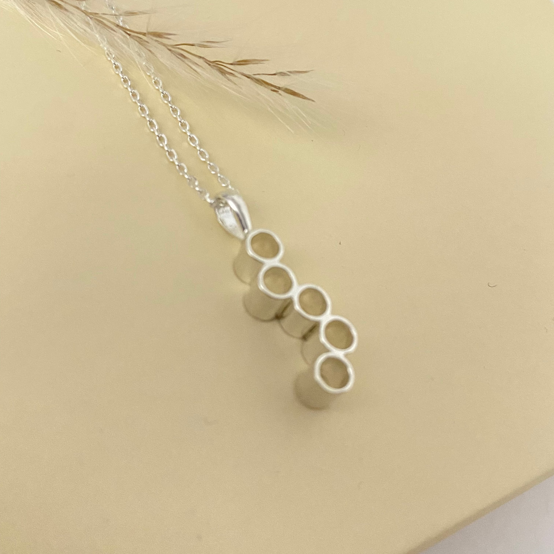 Elegant Honeycomb Necklace from Luisana Jewelry featuring a modern pendant design in silver