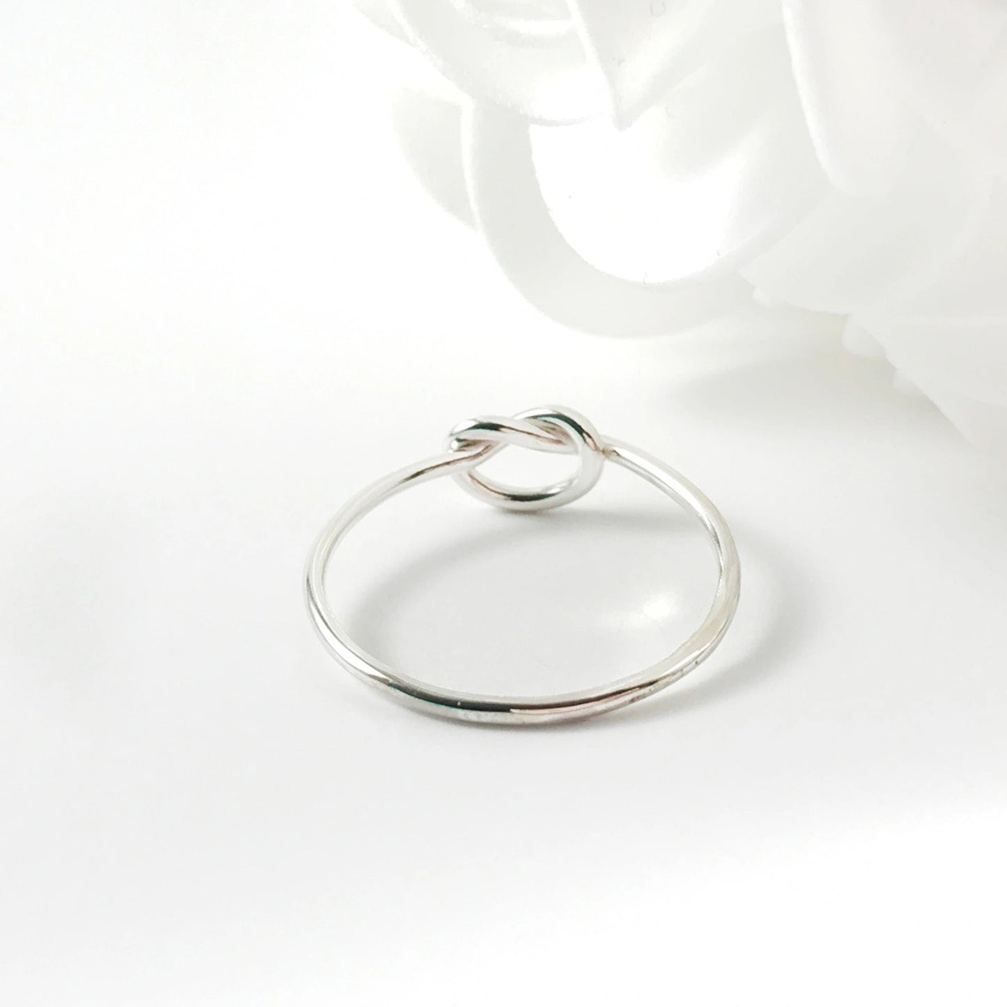 Minimalist silver love knot ring by Luisana Jewelry for elegant everyday wear