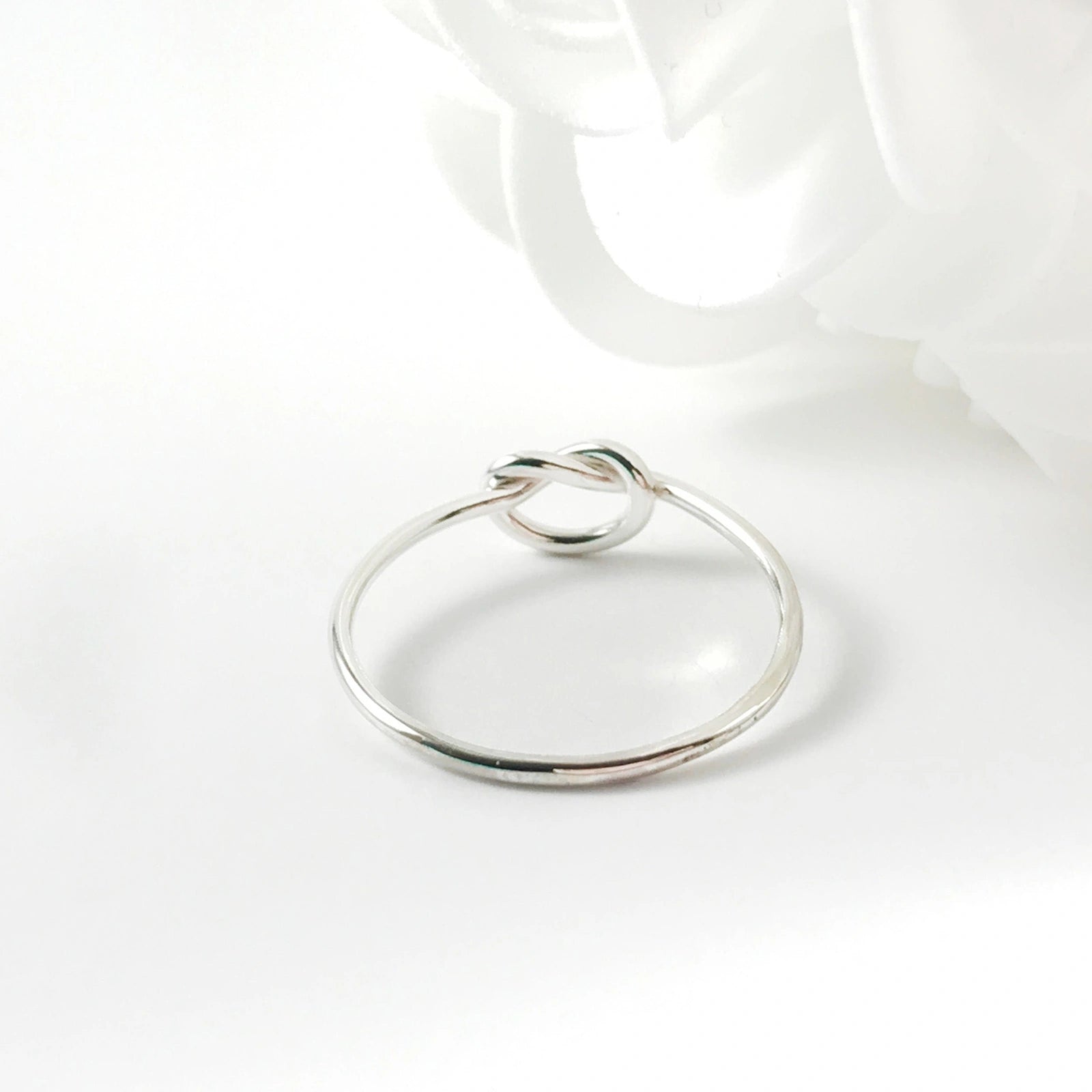 Minimalist silver love knot ring by Luisana Jewelry for elegant everyday wear