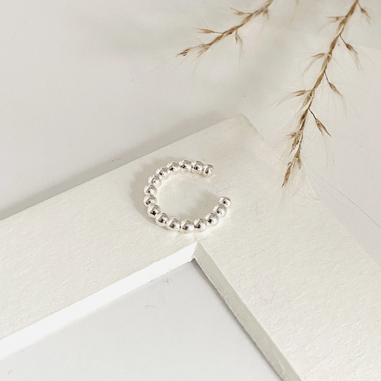 Luisana Jewelry Luna ear cuff in silver with a delicate design of small beads