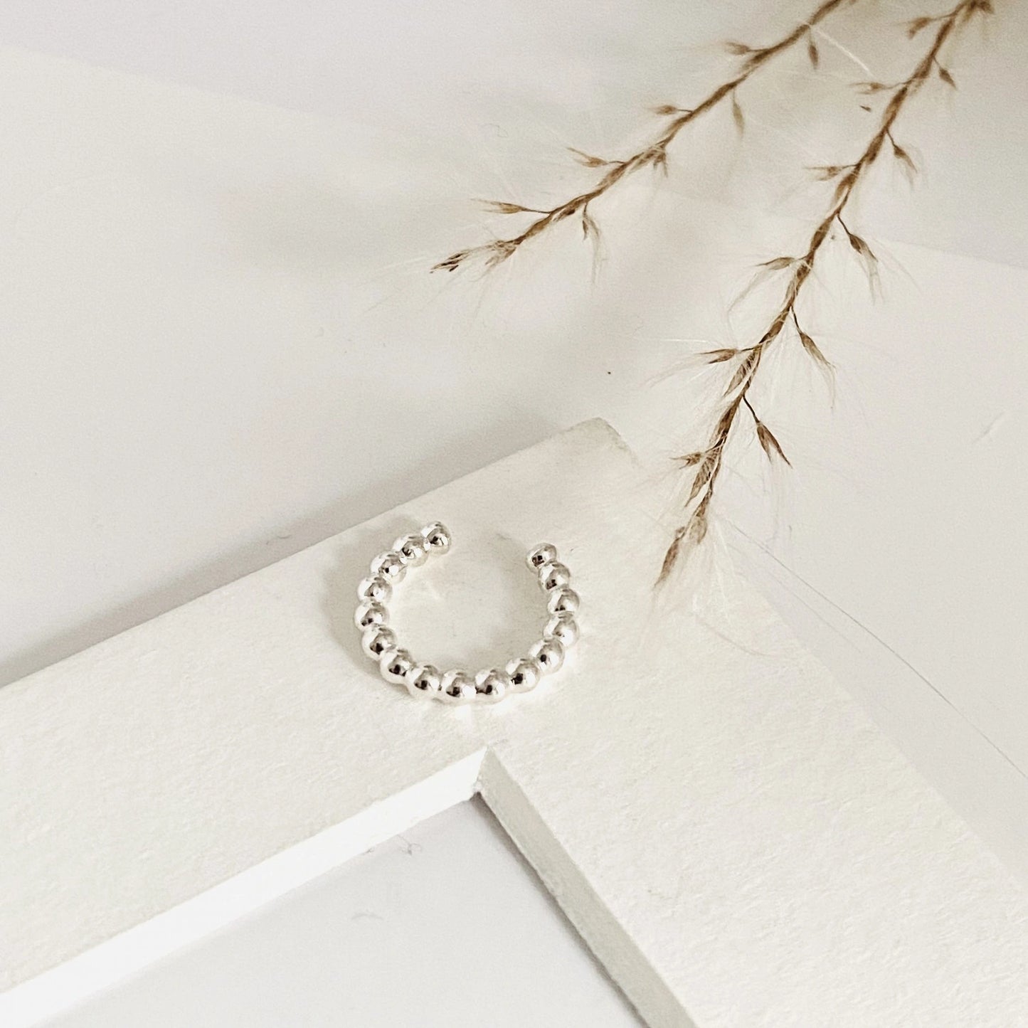 Luisana Jewelry Luna ear cuff in silver featuring a delicate bead design for a stylish accessory