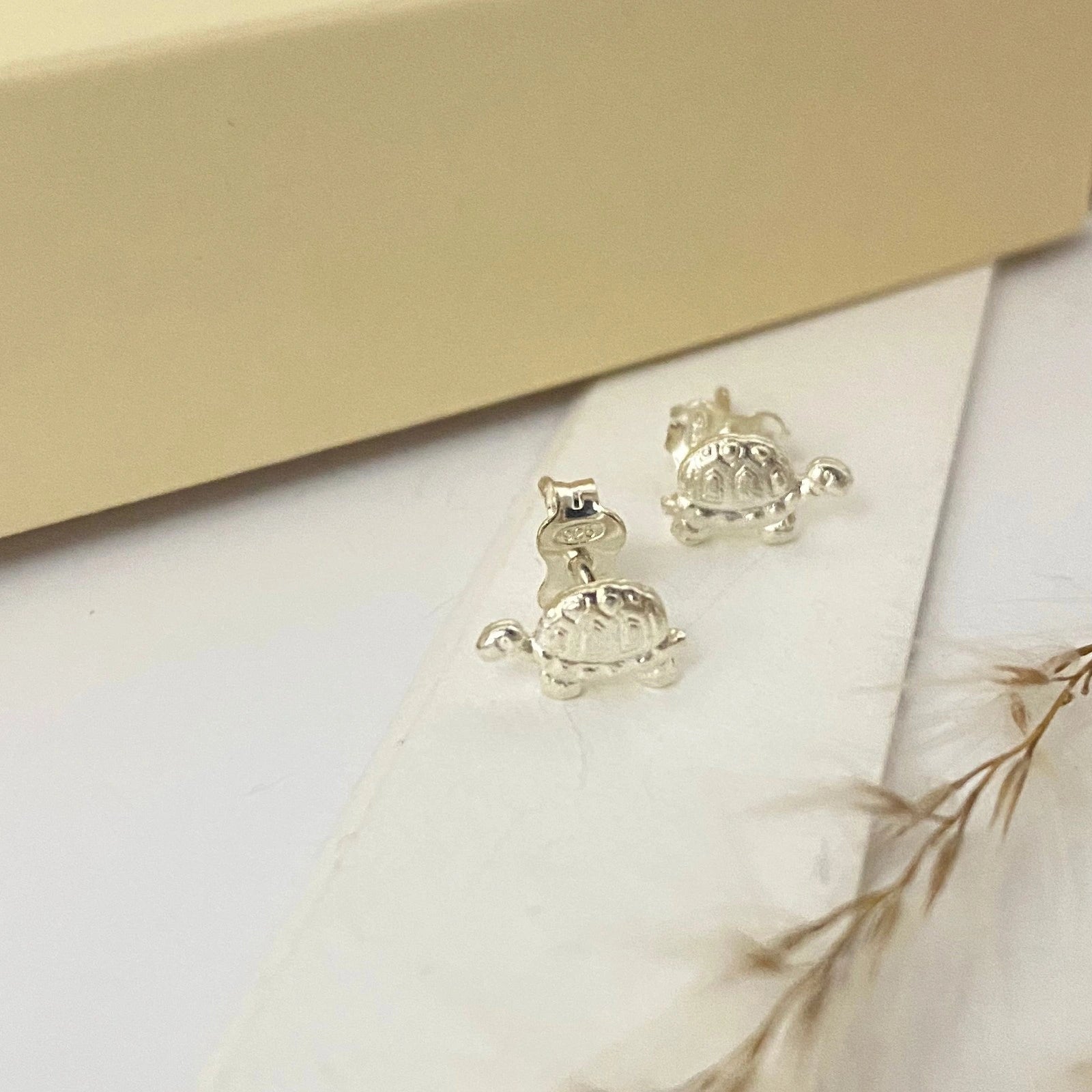 Luisana Jewelry Mini Turtle Studs in Silver, featuring detailed turtle design for a cute accessory