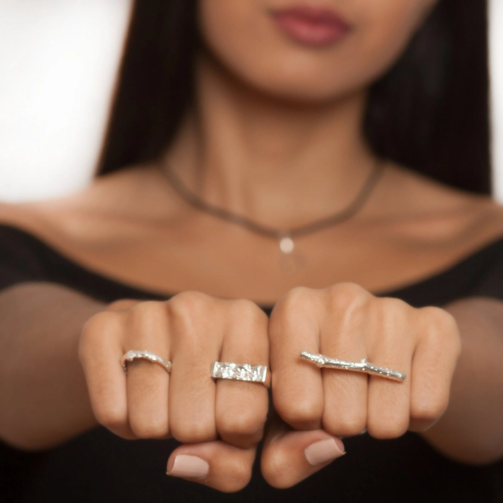 Elegant Nature Ring by Luisana Jewelry showcased on a model's hand with two additional rings
