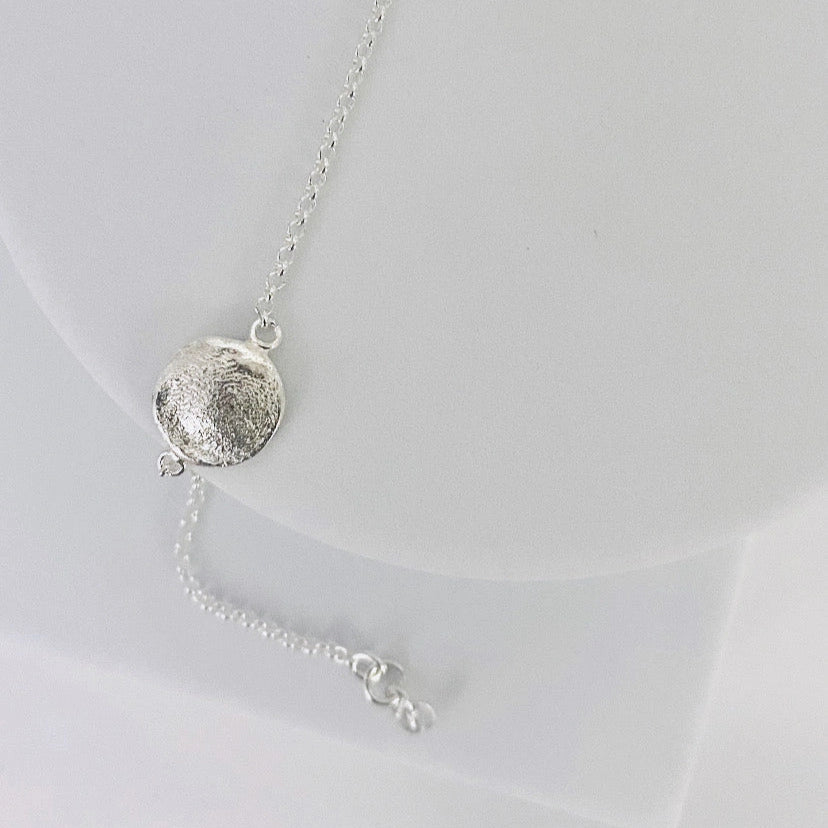 Luisana Jewelry Organic Love Bracelet in silver featuring a unique textured charm on a delicate chain