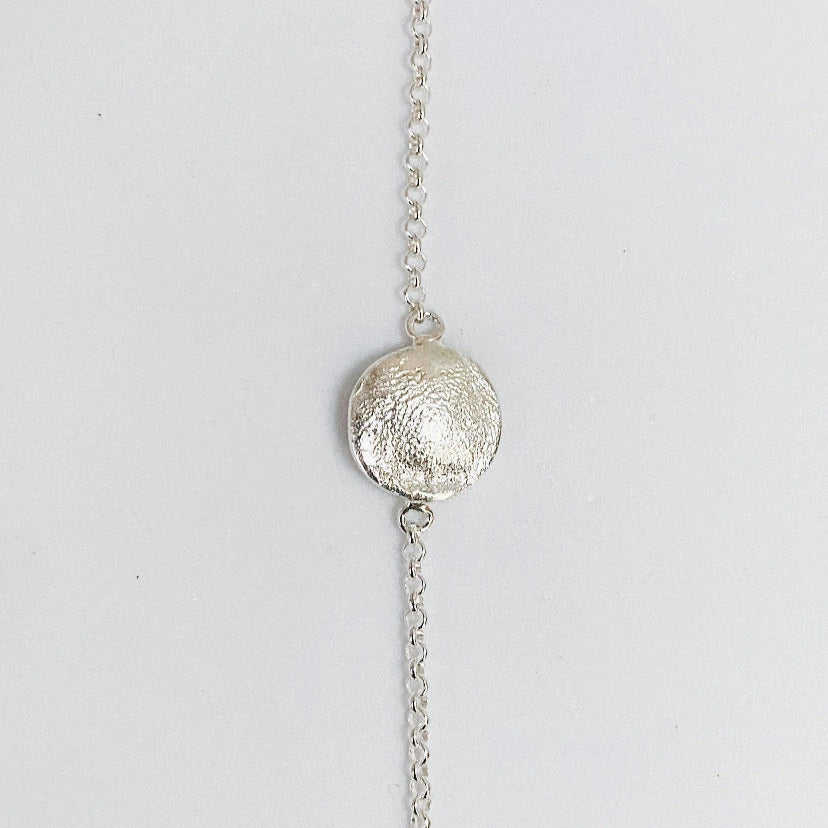 Elegant Organic Love Bracelet by Luisana Jewelry featuring a textured silver charm on a delicate chain