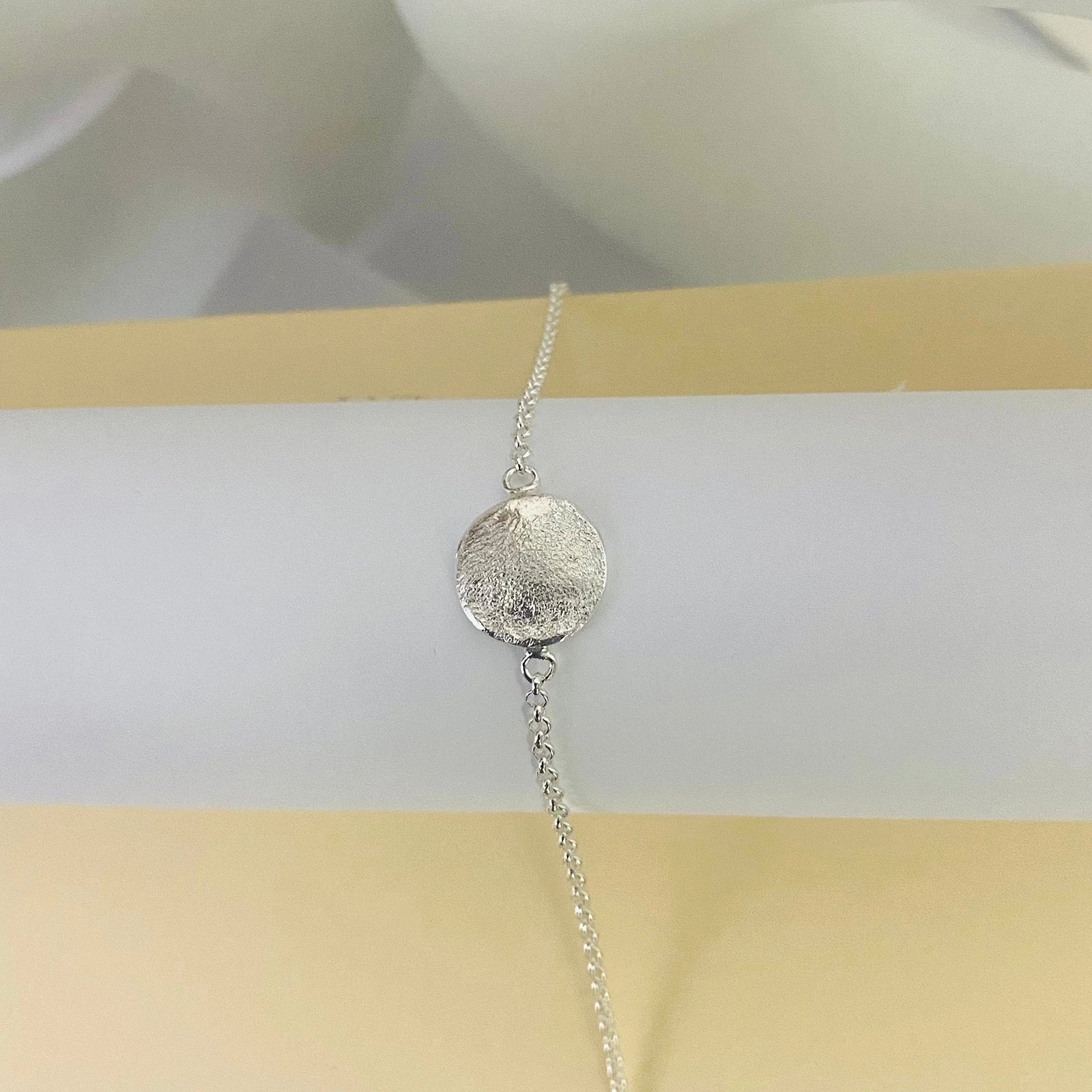 Elegant Organic Love Bracelet by Luisana Jewelry with a textured silver charm