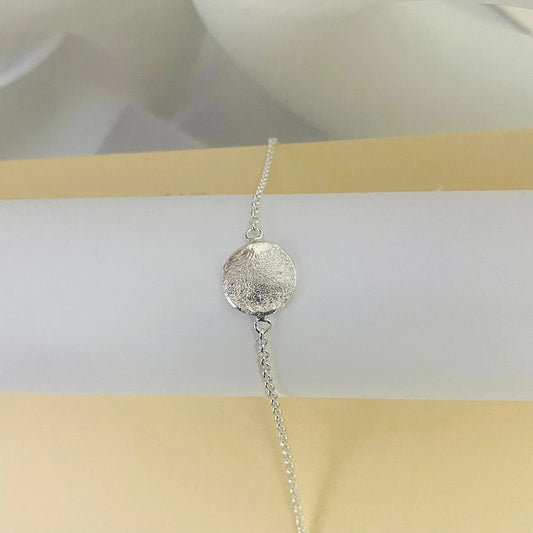 Elegant Organic Love Bracelet by Luisana Jewelry with a textured silver charm