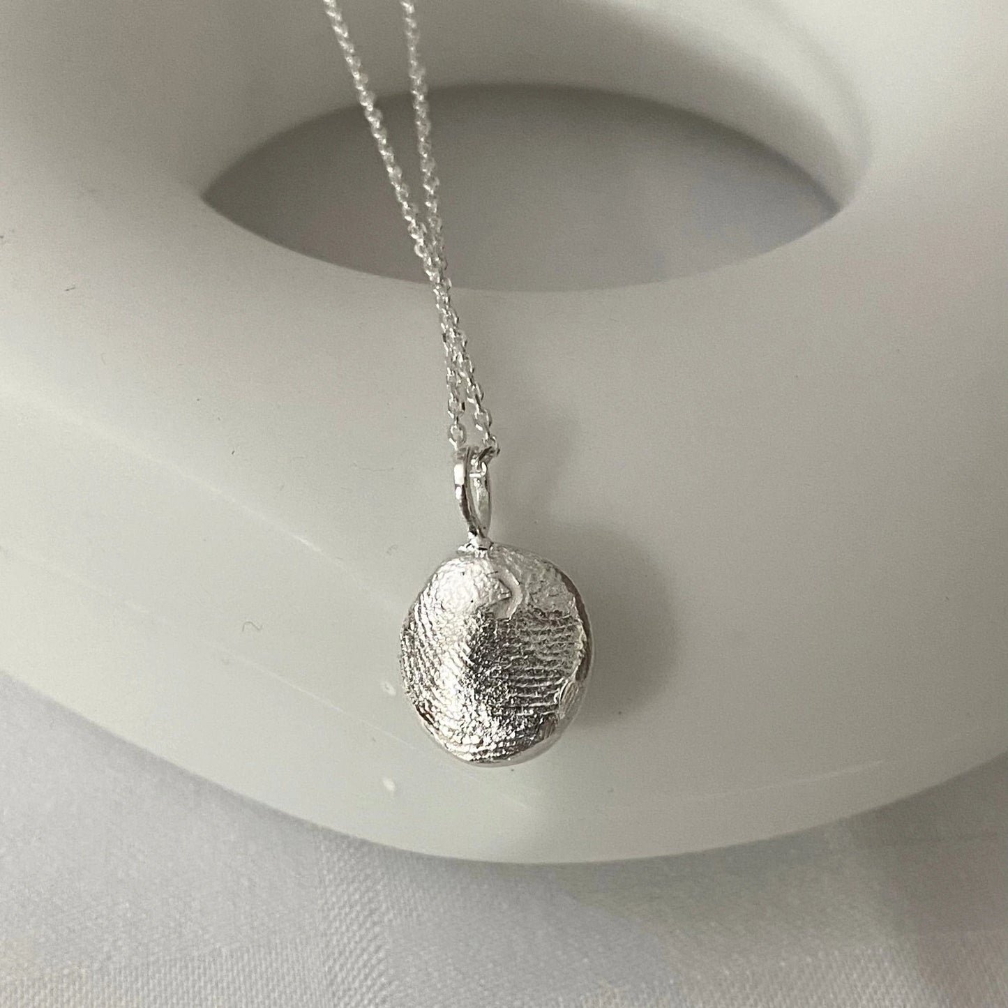 Luisana Jewelry Organic Love Charm on a delicate silver chain for a unique accessory