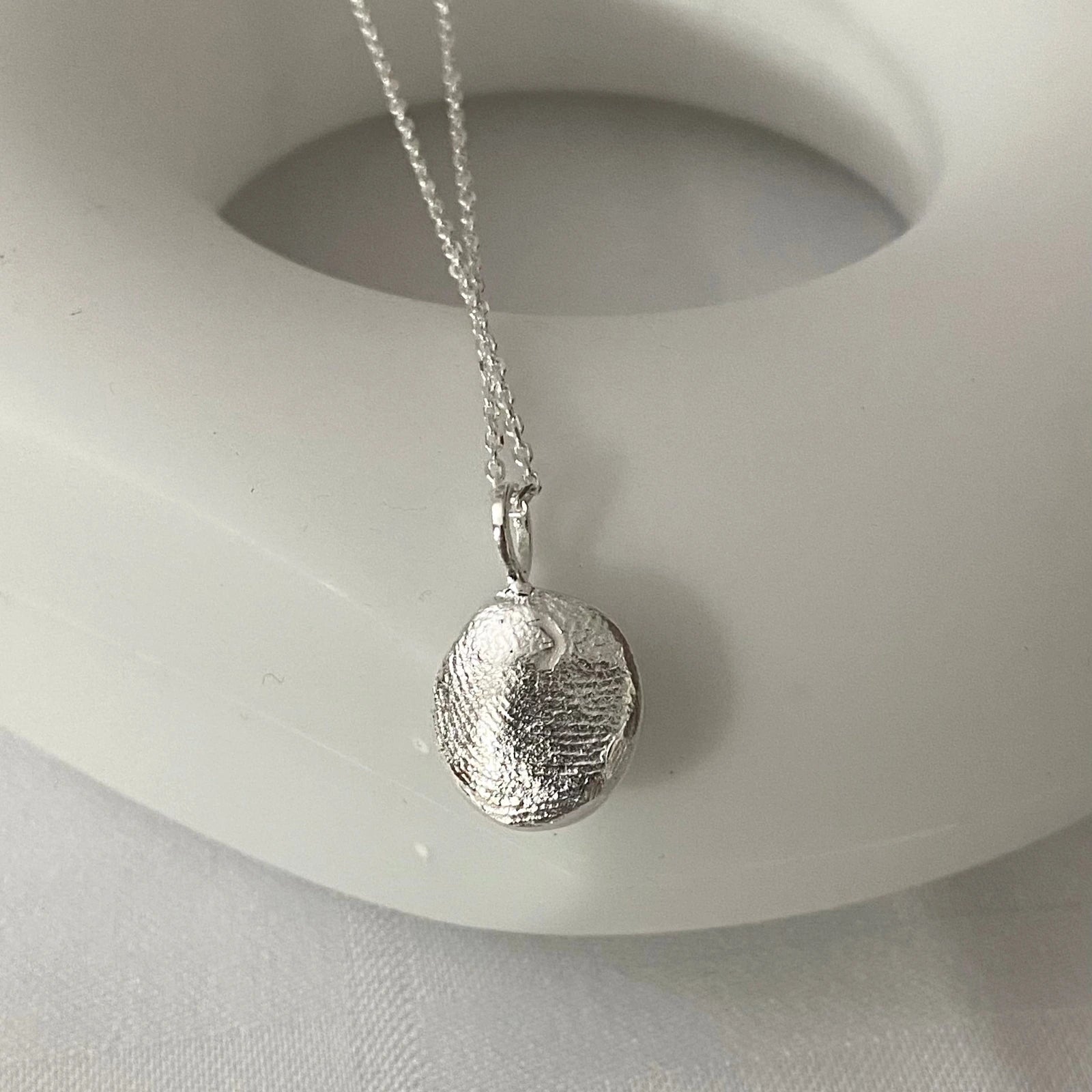 Luisana Jewelry Organic Love Charm on a delicate silver chain for a unique accessory