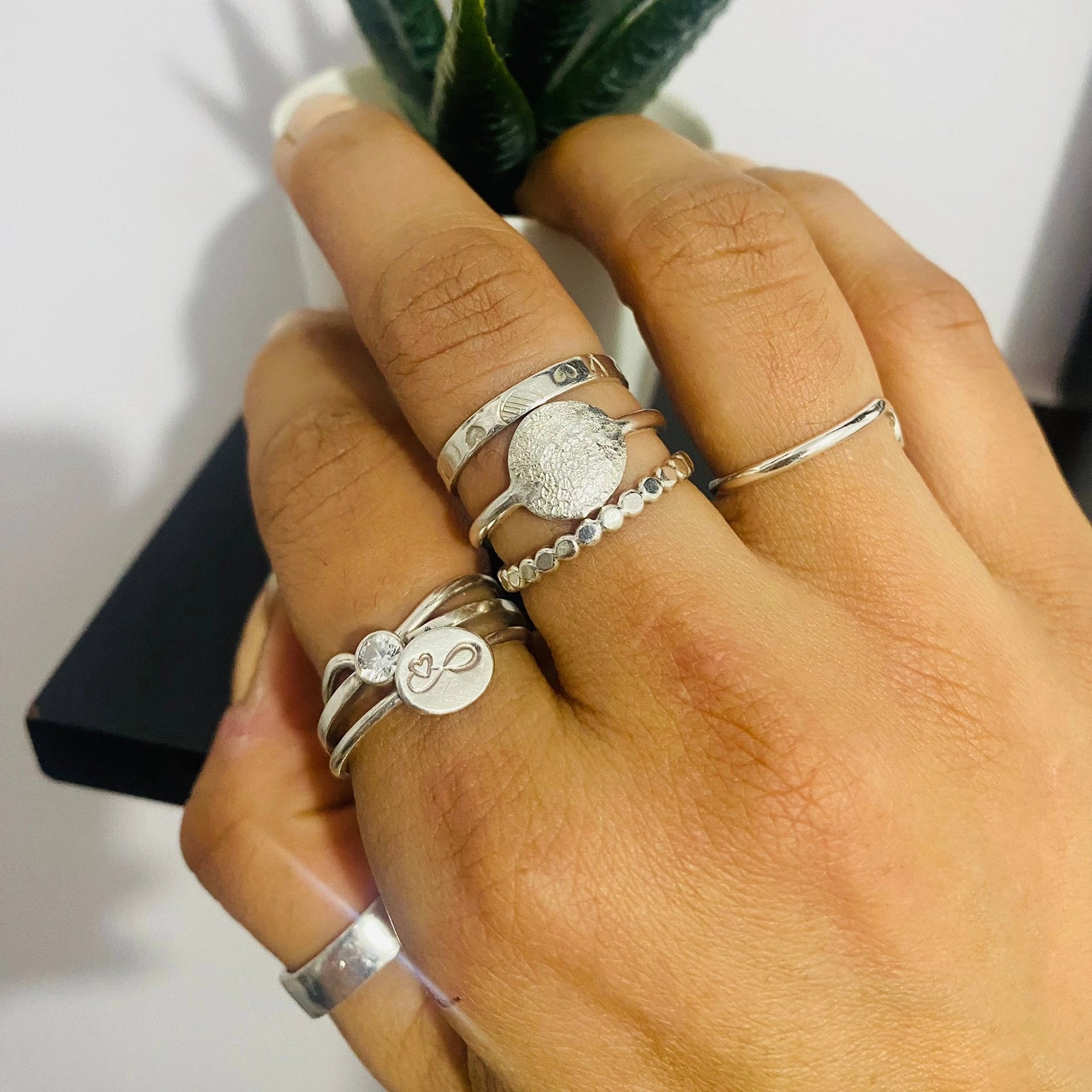 Luisana Jewelry Organic Love Ring with delicate silver design worn among other stylish rings