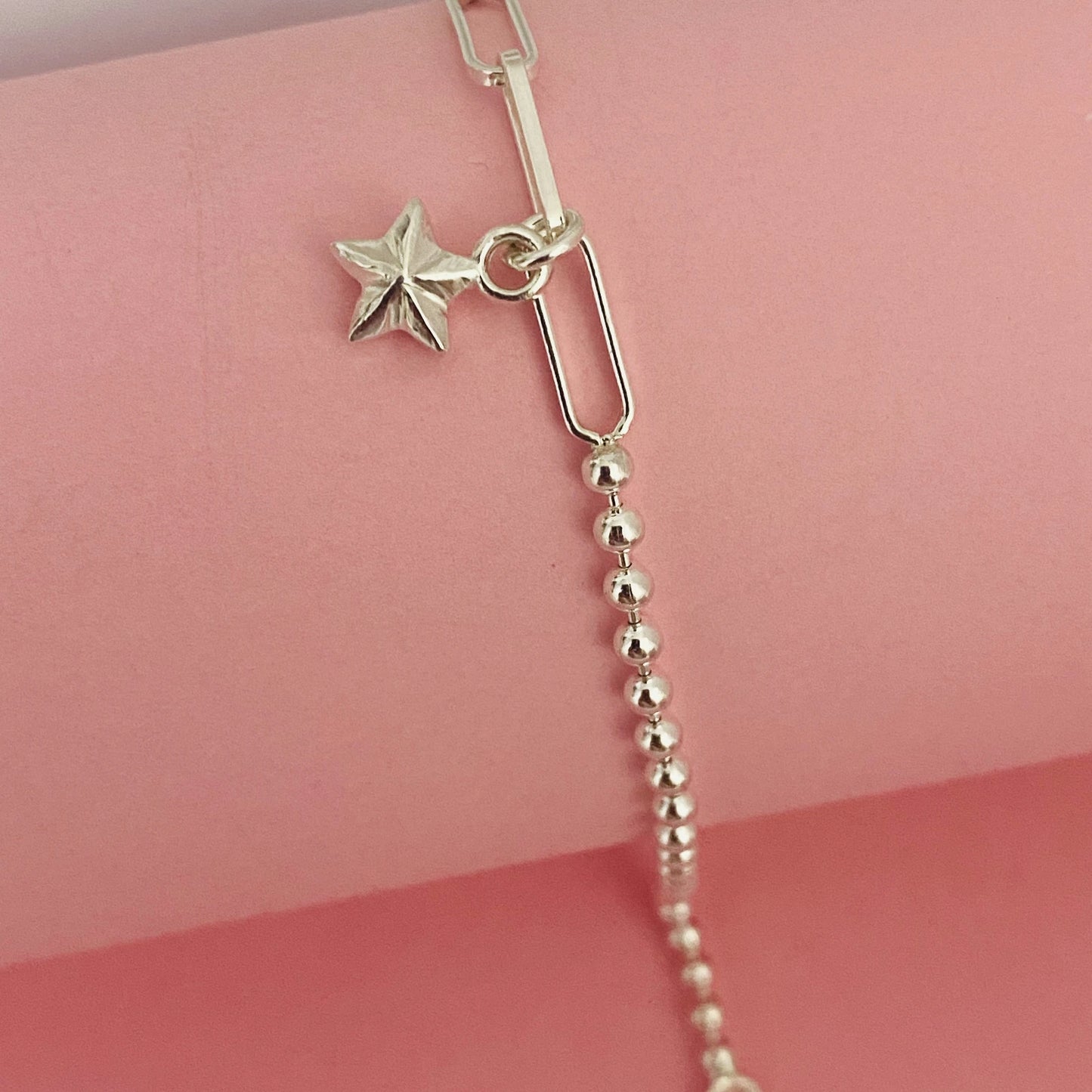 Luisana Jewelry radiant star bracelet with a silver star charm and beaded chain detail