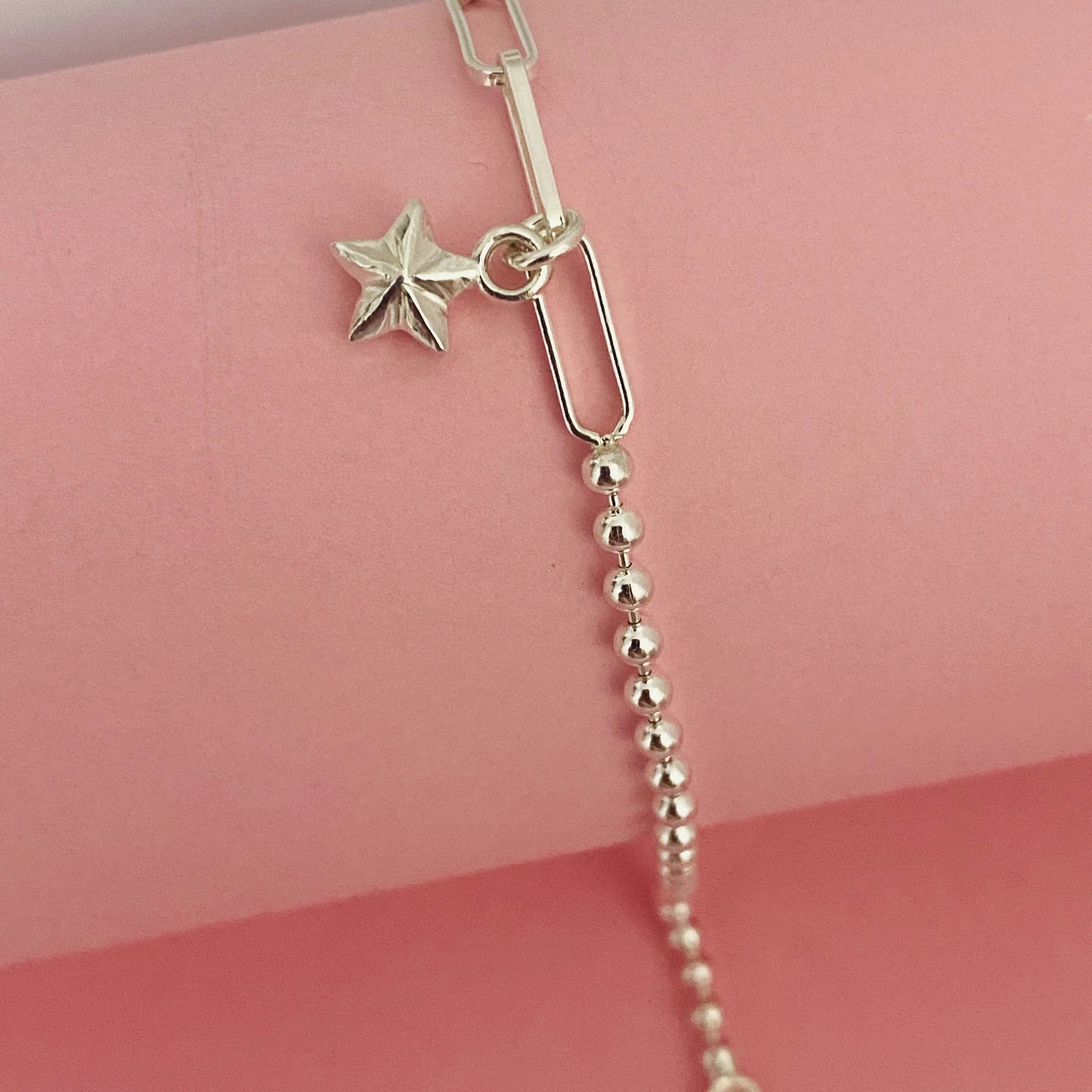 Luisana Jewelry radiant star bracelet with a silver star charm and beaded chain detail