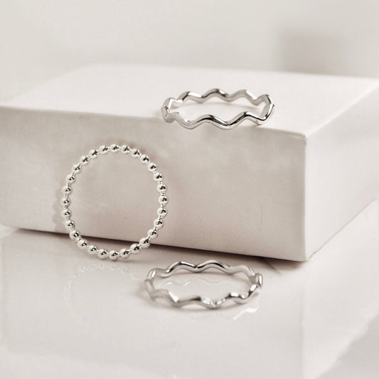 Set of three elegant Santorini Rings in silver featuring unique wave and bead designs